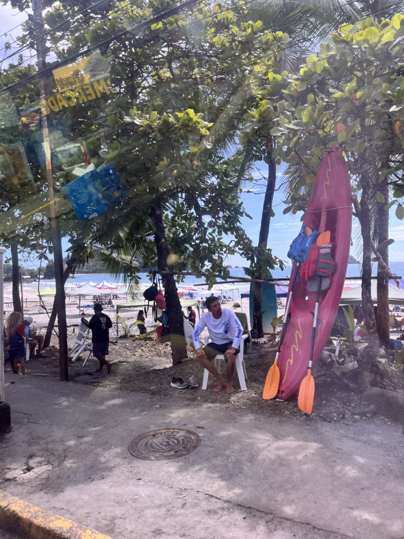 a view of the beach at manuel antonio costa rica showing the touristy nature