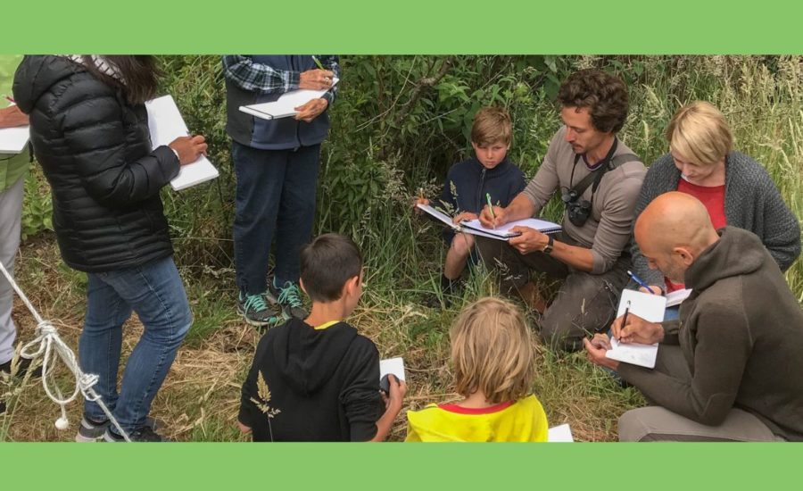 In this photo you can see Marley Peifer nature journaling with kids and adults. Some are homeschool kids, some are homeschool parents and other educators